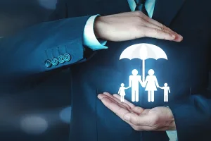 Hands Protecting a Family with an Umbrella – Comprehensive Insurance Solutions